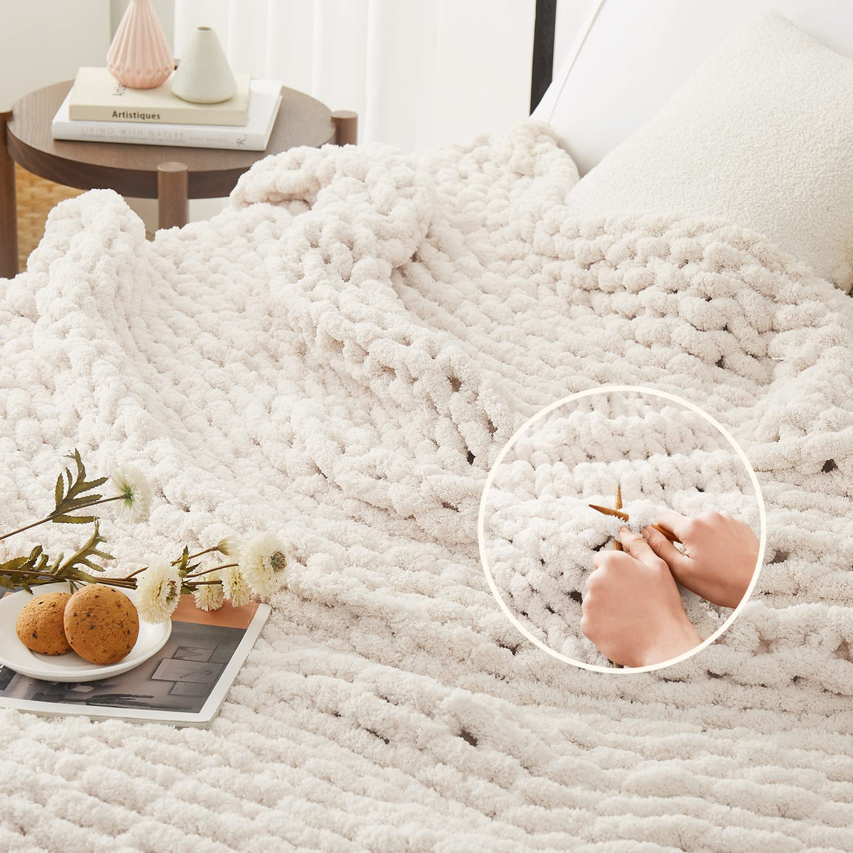 L'AGRATY hand-knit blanket displayed on bed adds warmth and breathable comfort.
