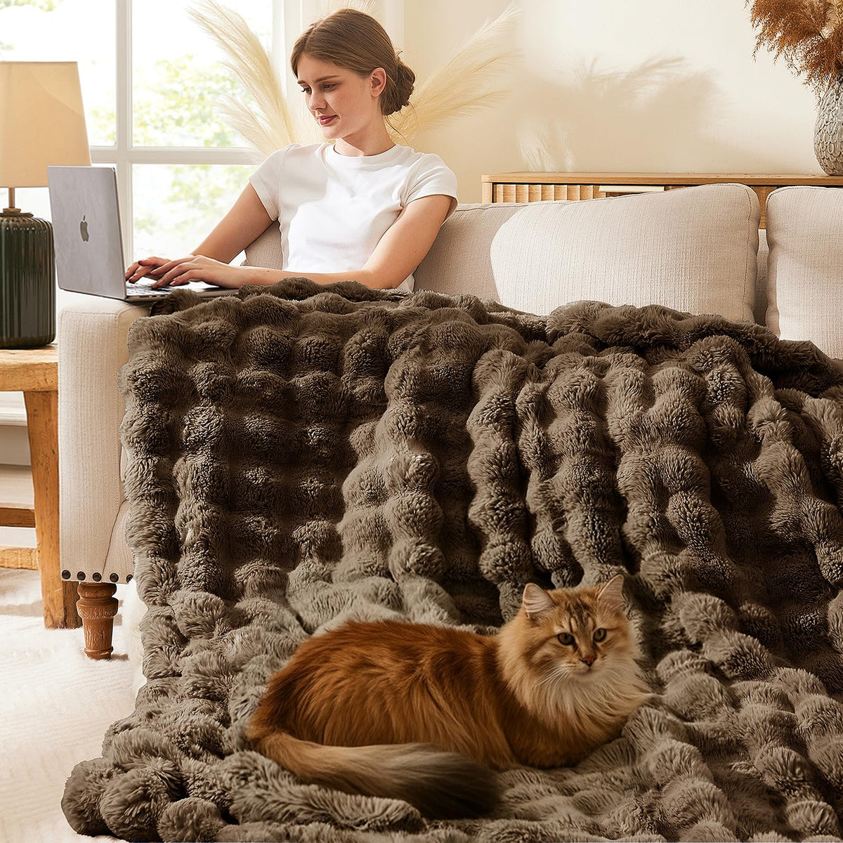 L'AGRATY reversible 650gsm rabbit fur with fleece lining for extra warmth.