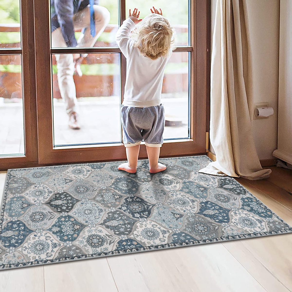 Lahome Elise blue ornate floor mat enhancing entryways with vintage charm.