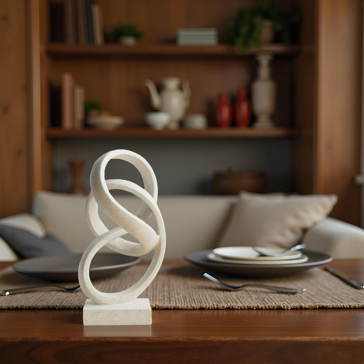 Laikearts white ribbon sculpture on a coffee table acts as a design anchor
