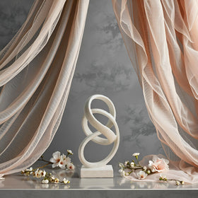 Laikearts white ribbon sculpture presented as a thoughtful gift for art lovers
