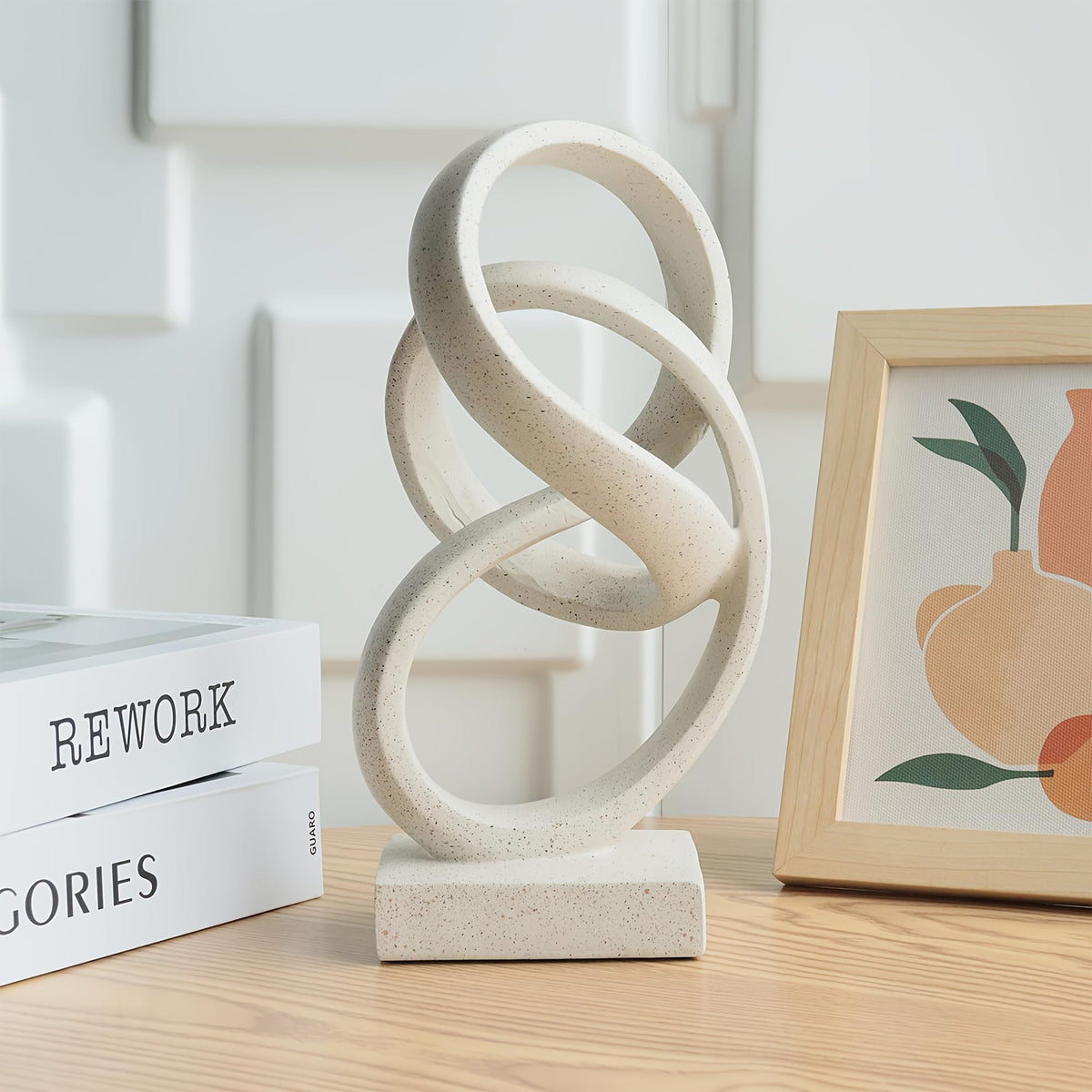 Laikearts white knot sculpture adds a contemporary focal point on a coffee table