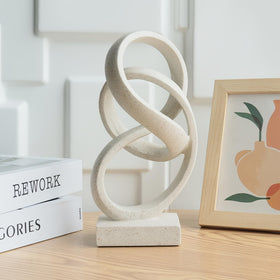 Laikearts white knot sculpture adds a contemporary focal point on a coffee table