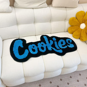 LAKEA cookies rug blue with orange and yellow accents for vibrant decor.