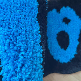 LAKEA Cookies Rug blue irregular shape adds playful charm to spaces.