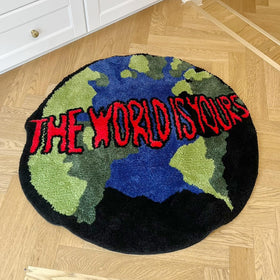 LAKEA Earth Round Mat doubles as a cozy bedroom rug near doorways.