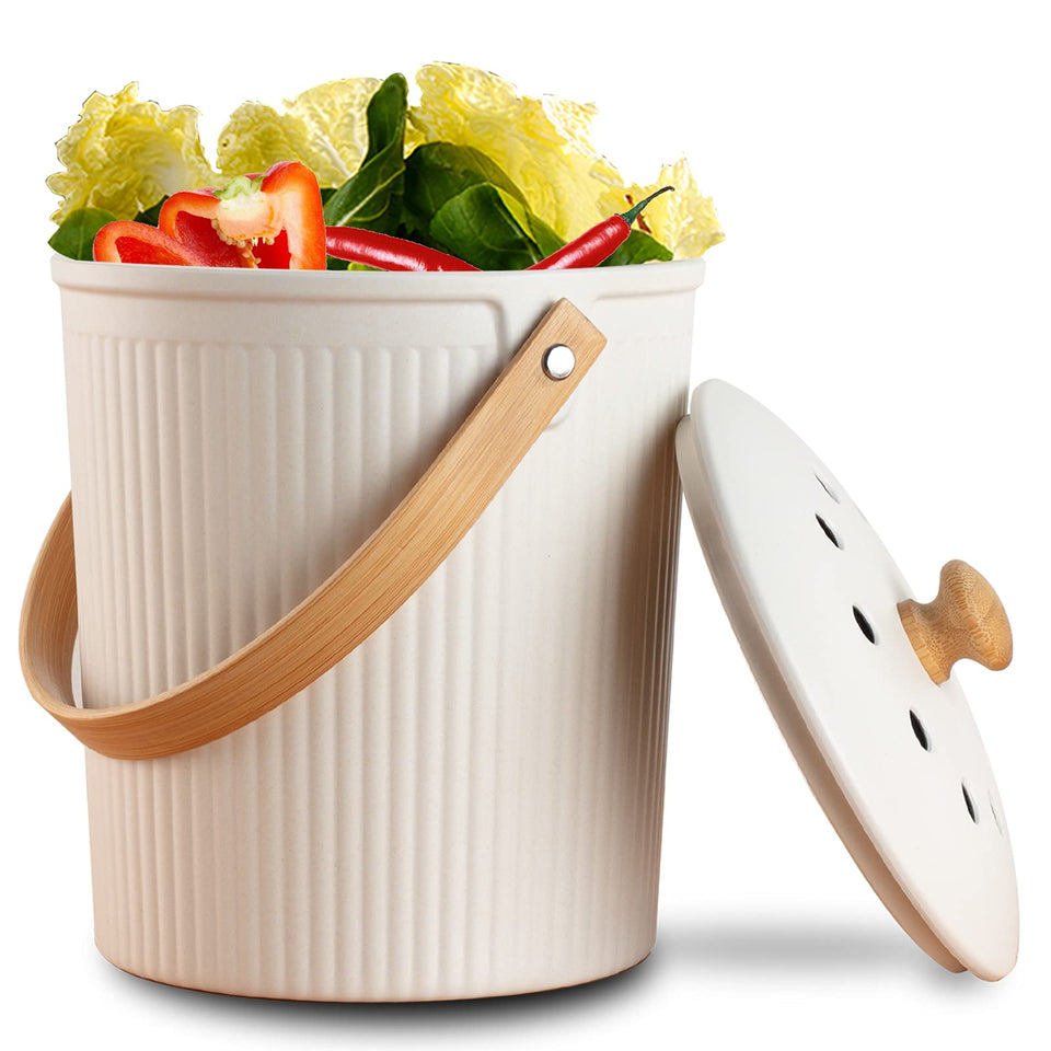 LALASTAR countertop compost bin with cream lid sits on a kitchen counter.