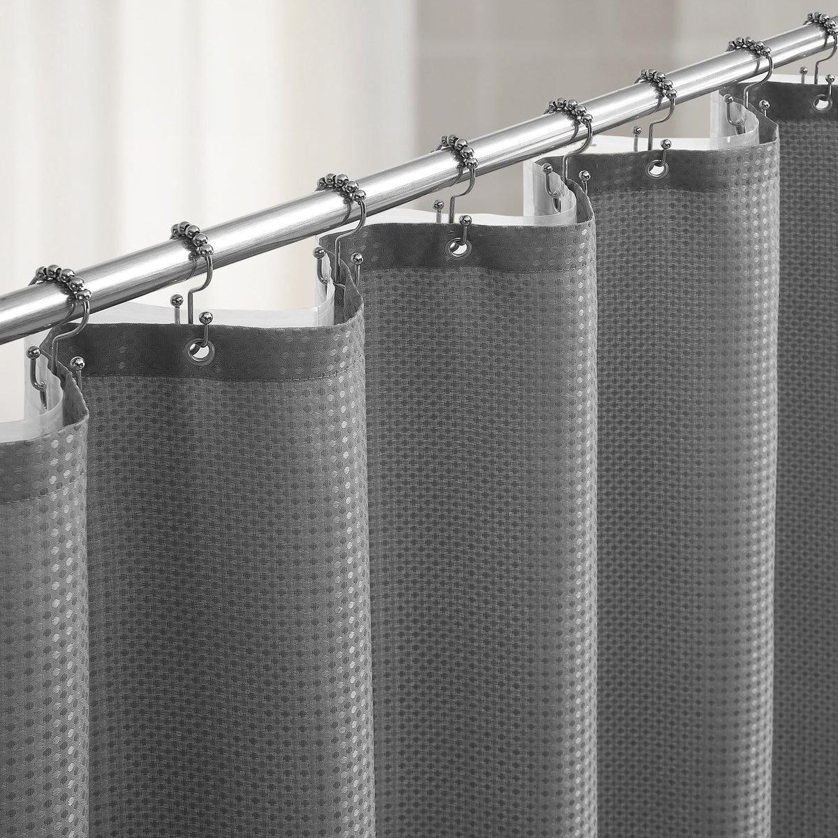 Lameirose grey 3-in-1 waffle curtain in action keeps bath dry.