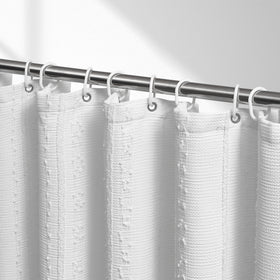 Lameirose white shower curtain closeup of waffle texture and stripe detailing for a stylish bath.