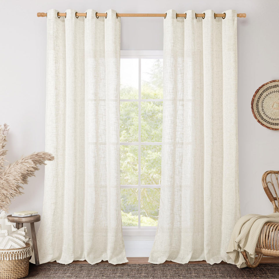 LAMIT cream linen curtains with bronze grommets frame a cozy living room view