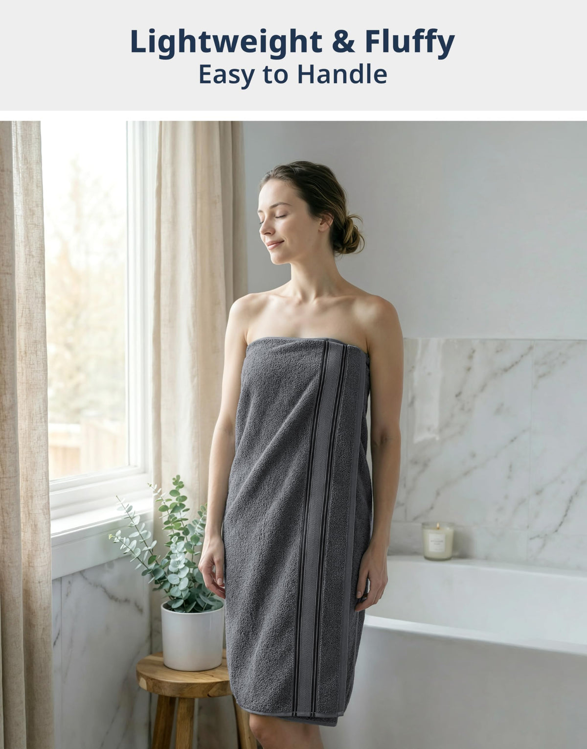 Lane Linen bath towels in cool grey draped for spa-like bathroom aesthetic.