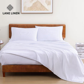 Lane Linen fitted sheet with deep pockets, stays snug on deeper mattresses.