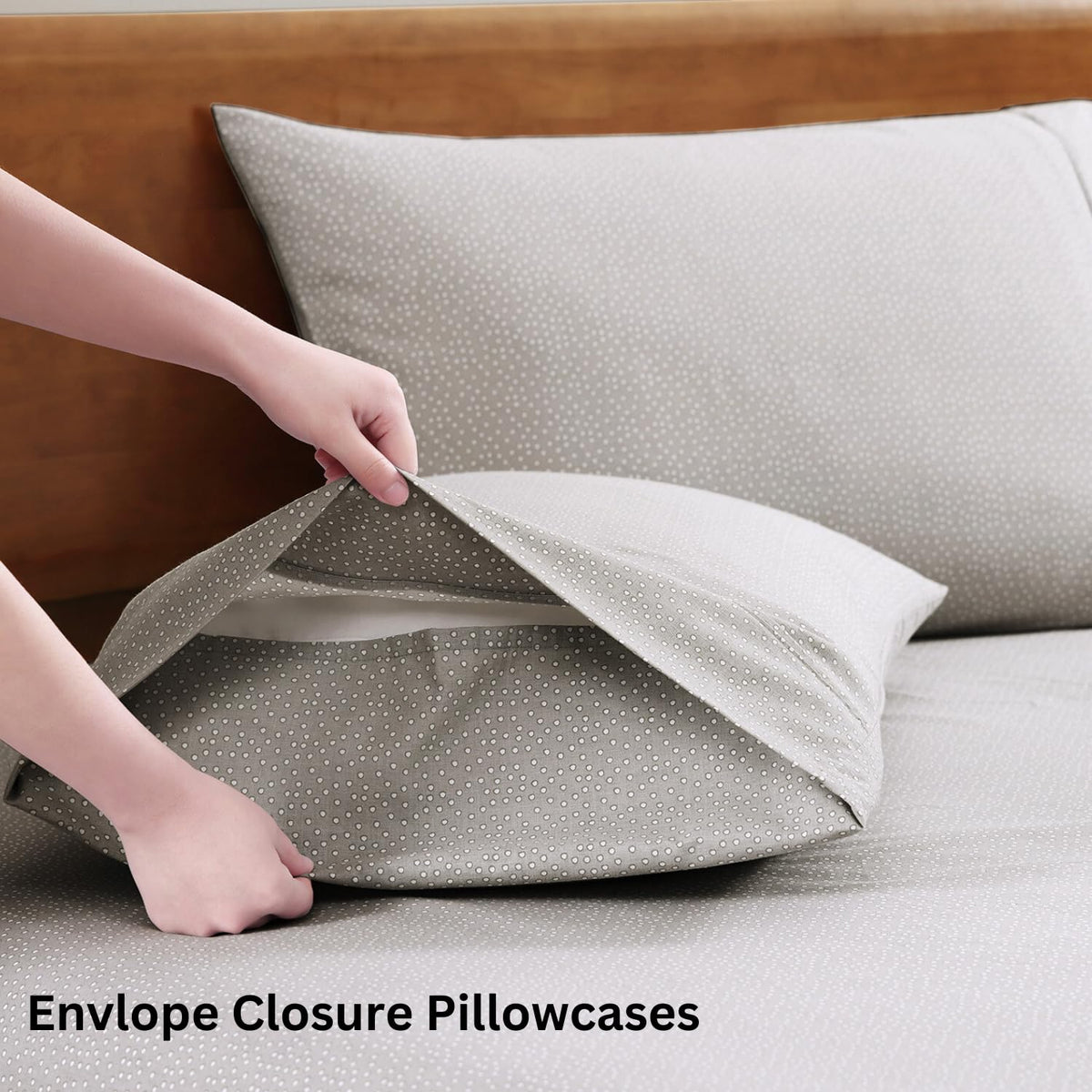 Lane Linen Snowdrop two pillowcases ready for use on bed.