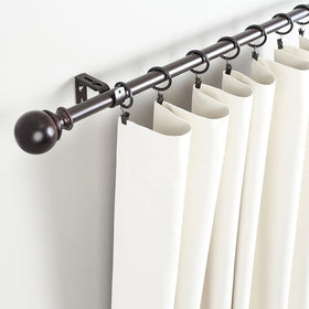 Lansian curtain rings attached to drapery demonstrate secure hanging and easy setup.