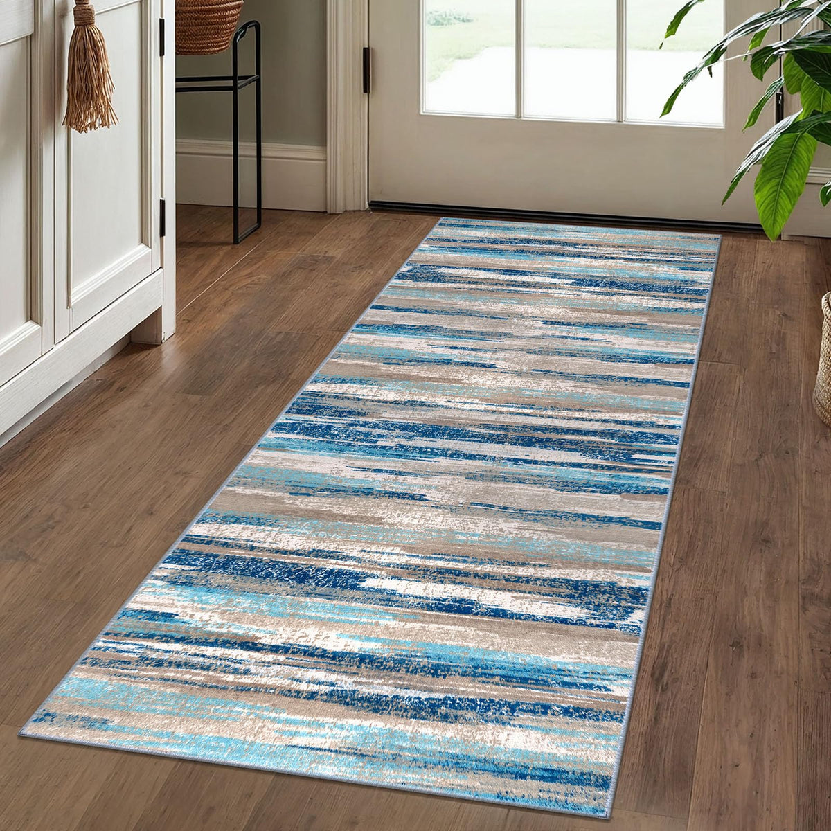 Lansny blue abstract rug 2x5 showcases fade-resistant colors and easy cleaning for entryways.