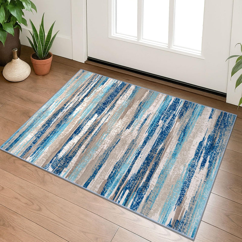 Lansny small abstract rug in aqua and beige tones adds soft, non-slip comfort to entryways