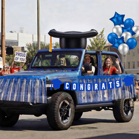 LaRandom tassel banner elevates the graduation theme on the vehicle