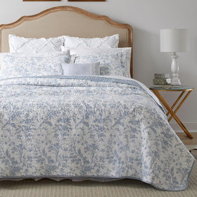 Laura Ashley Amberley Blue king quilt on bed showing reversible design and soft cotton comfort
