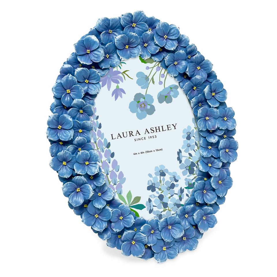 Laura Ashley blue hydrangea oval frame with easel highlights memories on a desk