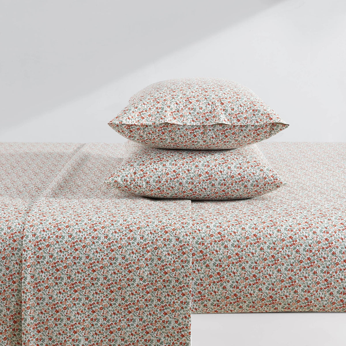 Elastic edge on fitted sheet keeps Laura Ashley Emogene Burnt Orange king sheets in place