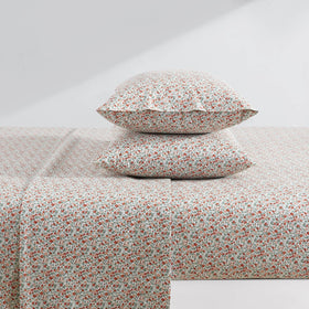Elastic edge on fitted sheet keeps Laura Ashley Emogene Burnt Orange king sheets in place