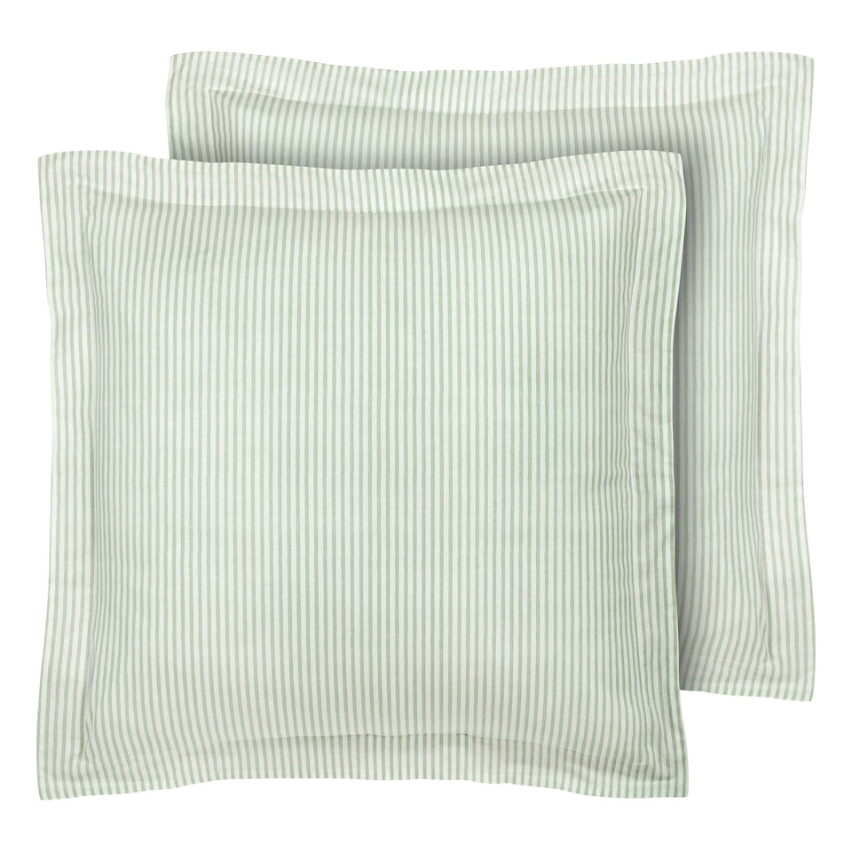 Laura Ashley euro sham in green ticking stripe on bed for timeless decorative layering.