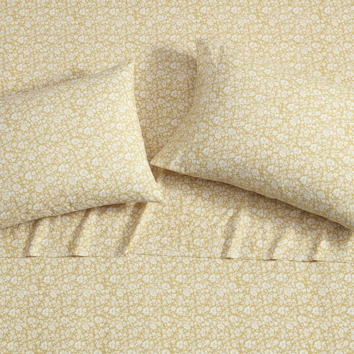 Elegant Laura Ashley bedroom scene featuring Heirloom Disty Gold bedding.