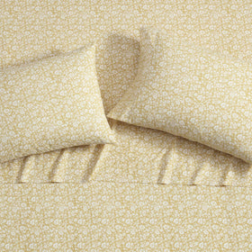 Elegant Laura Ashley bedroom scene featuring Heirloom Disty Gold bedding.