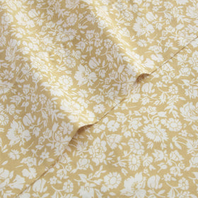 Closeup of Laura Ashley Heirloom Disty Gold percale weave texture and sheen.