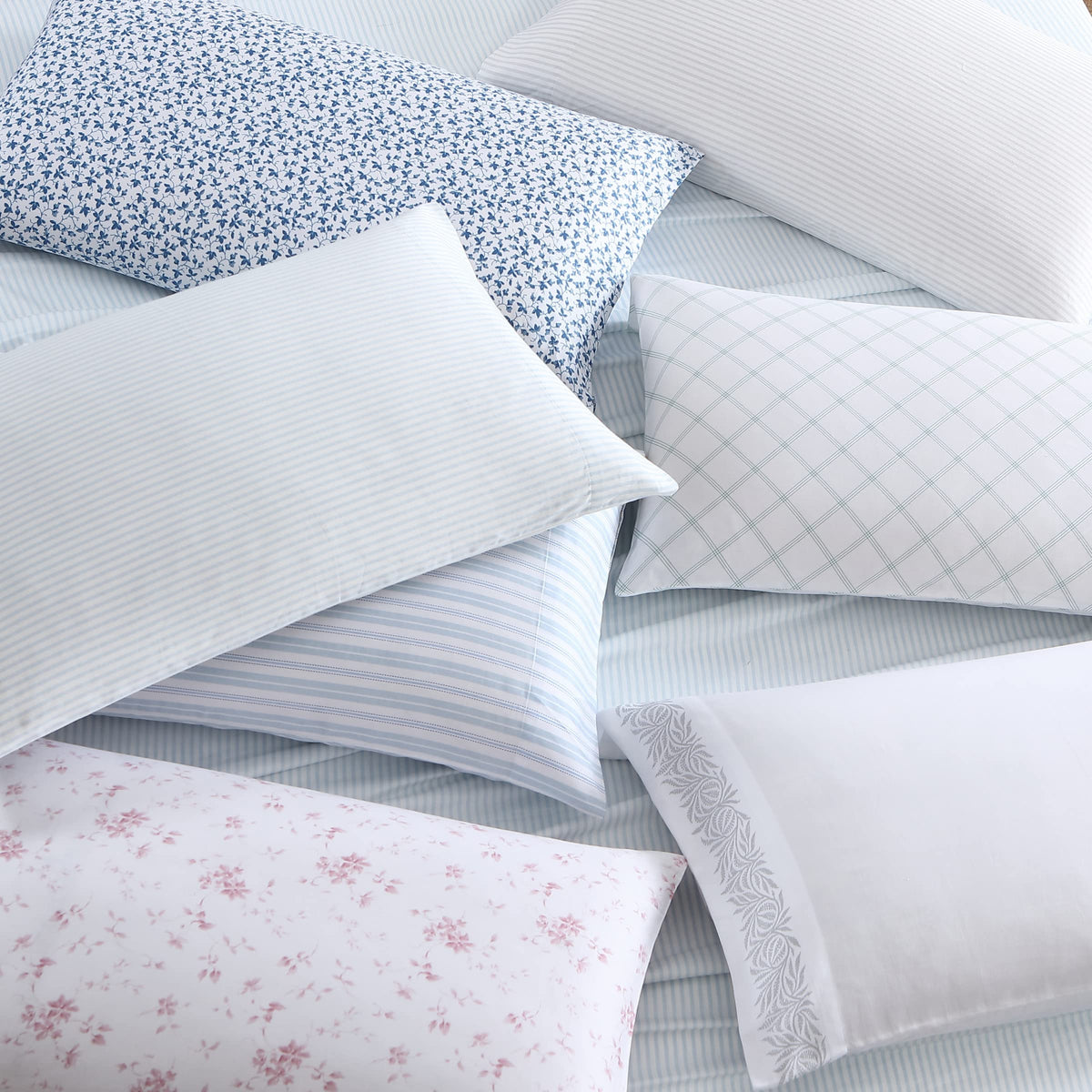 Pillowcase on a neatly made bed with Ramona Blue tones.