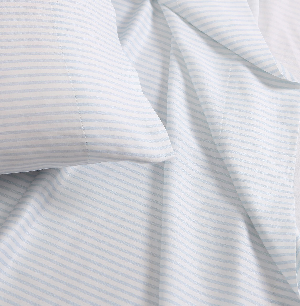 Laura Ashley queen flat sheet for layered, polished bedding look.