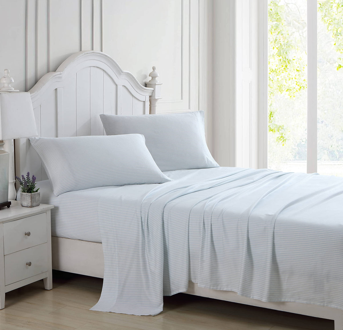 Laura Ashley striped blue and white design enhances timeless bedroom style.
