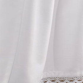 White bed skirt from Laura Ashley complements dorm decor with classic charm