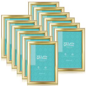 LaVie Home 4x6 gold frame set on wall and table displays photos.