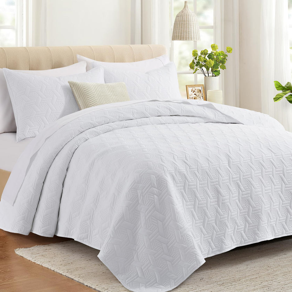 Lavsiry white queen quilt set on bed offers lightweight all-season comfort.