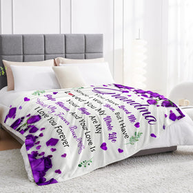 Lavua Grandma Blanket folded on coffee table reflects versatile home comfort.