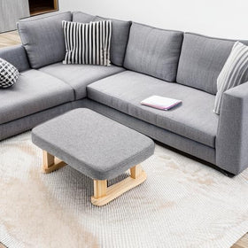 Lawei footstool in living room scene as a versatile footrest and decor