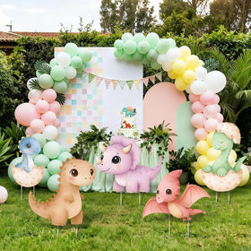 LawnIdyll green dinosaur cutout enhances outdoor party decor