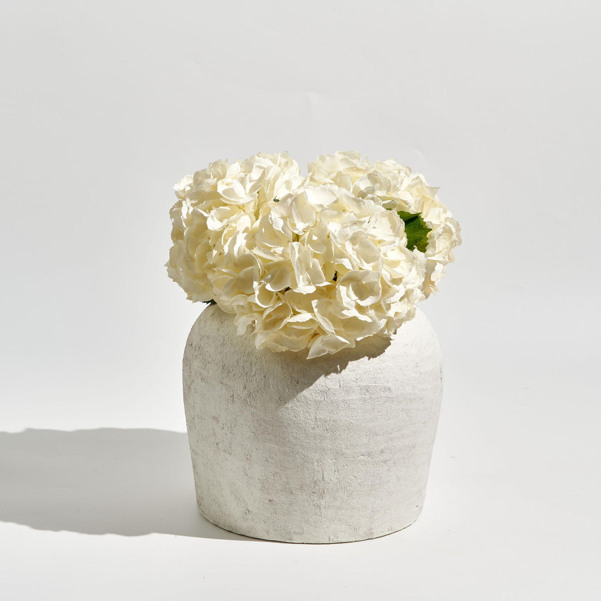 LB2 distressed farmhouse vase anchors any vignette, from dining tables to entryway mantels.