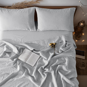 LBRO2M linen sheet set on a queen bed in grey for all-season comfort