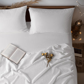LBRO2M pure linen flat sheet on queen bed showing breathable all-season comfort