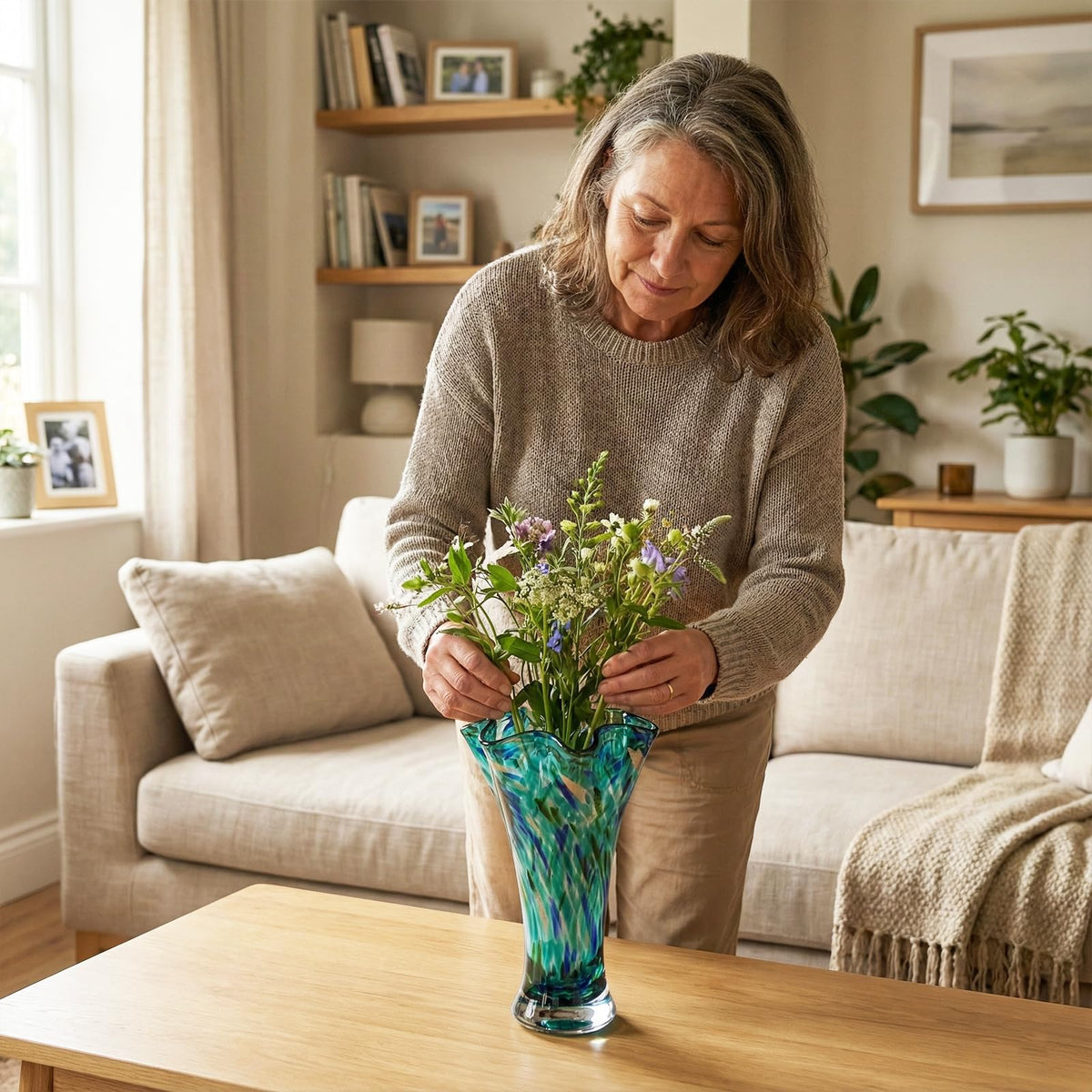LCCCK teal glass vase as a centerpiece for living room décor.