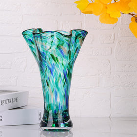LCCCK teal glass vase on office shelf adds elegance.