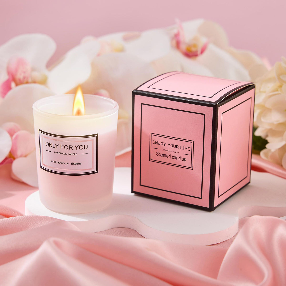 LE CADEAU rose-scented candle creating a relaxing spa ambiance