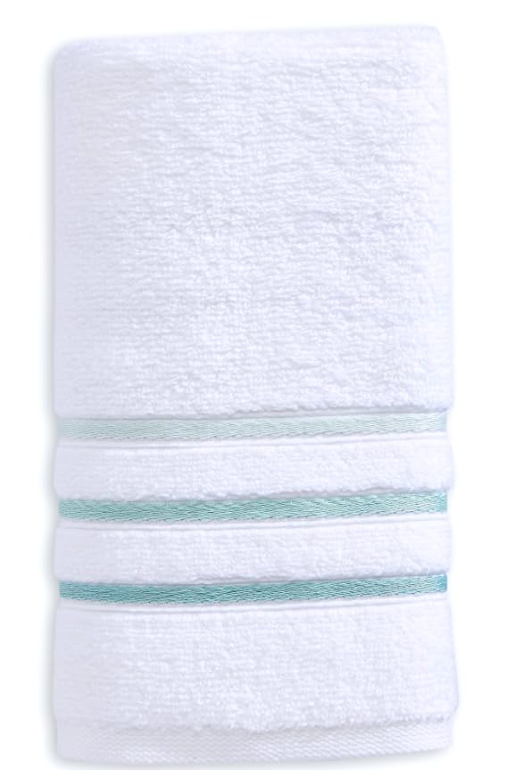 Luxury towels folded neatly on a spa-style display