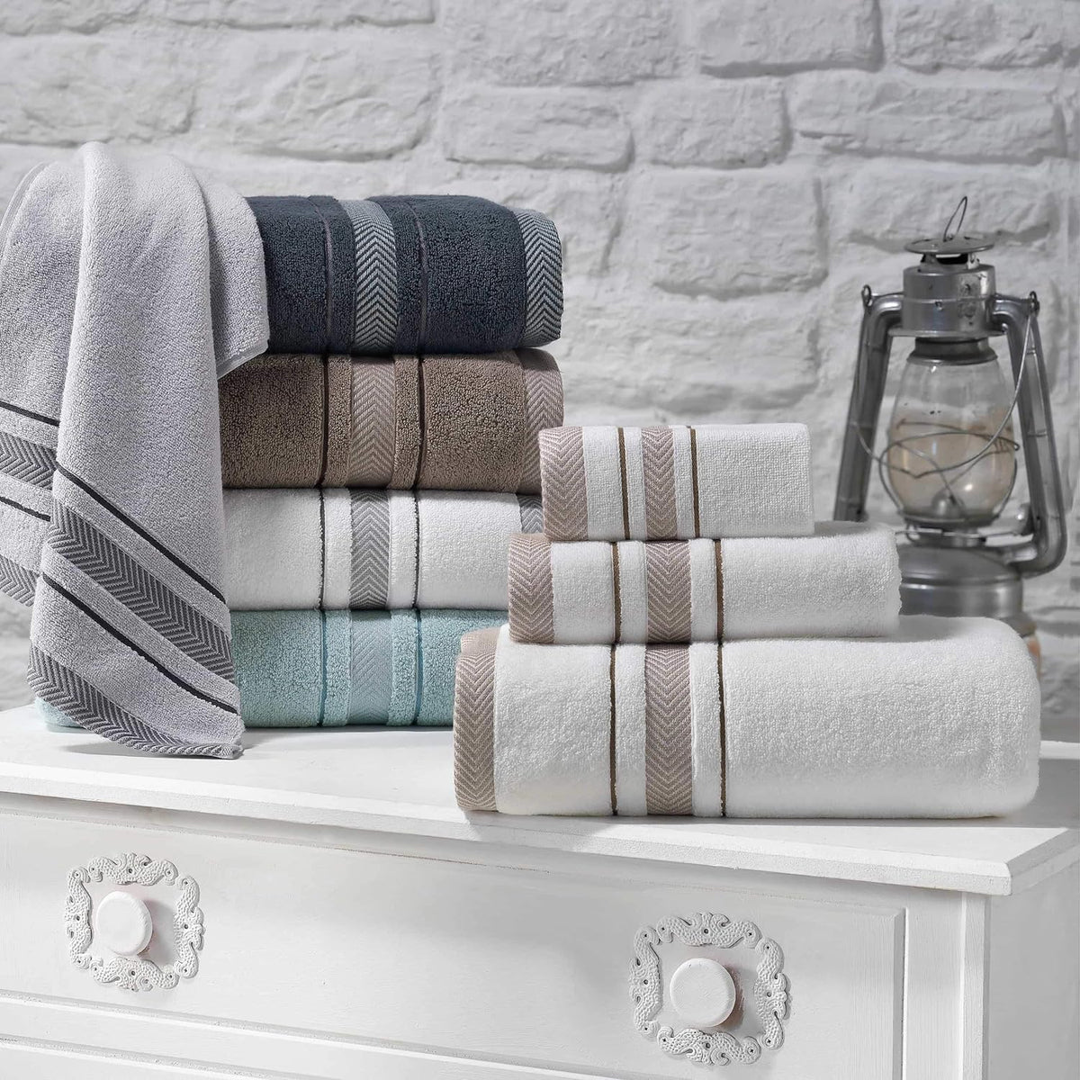 Le fil blanc white and grey stripe towels draped over rack