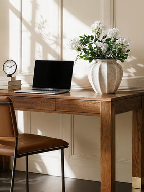 LE TAUCI white ceramic vase serves as a versatile tabletop centerpiece.