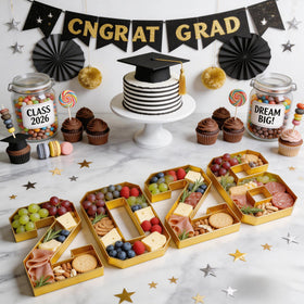 Leadinor graduation centerpiece idea with gold-toned number tray lights up the table.