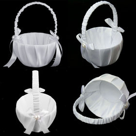 Lebsitey flower basket with pearl-embellished bow, adding romantic shimmer to the aisle.