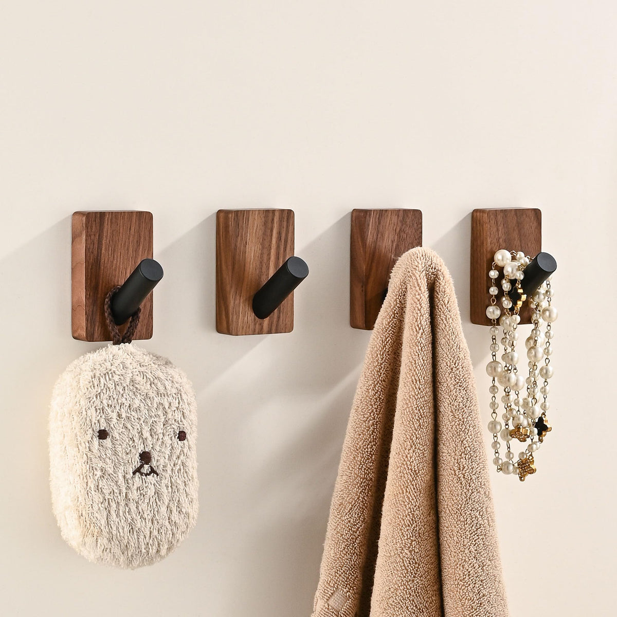 LECHYN wooden wall hook set four-pack with natural walnut base for versatile entryway organization.